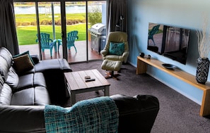 Family Apartment, 2 Bedrooms, 2 Bathrooms, River View | Living area | 55-inch flat-screen TV with premium channels, TV, Netflix