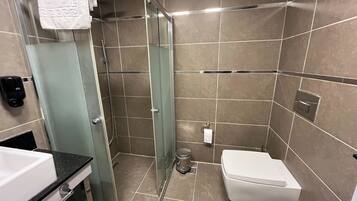 Shower, free toiletries, hair dryer, slippers