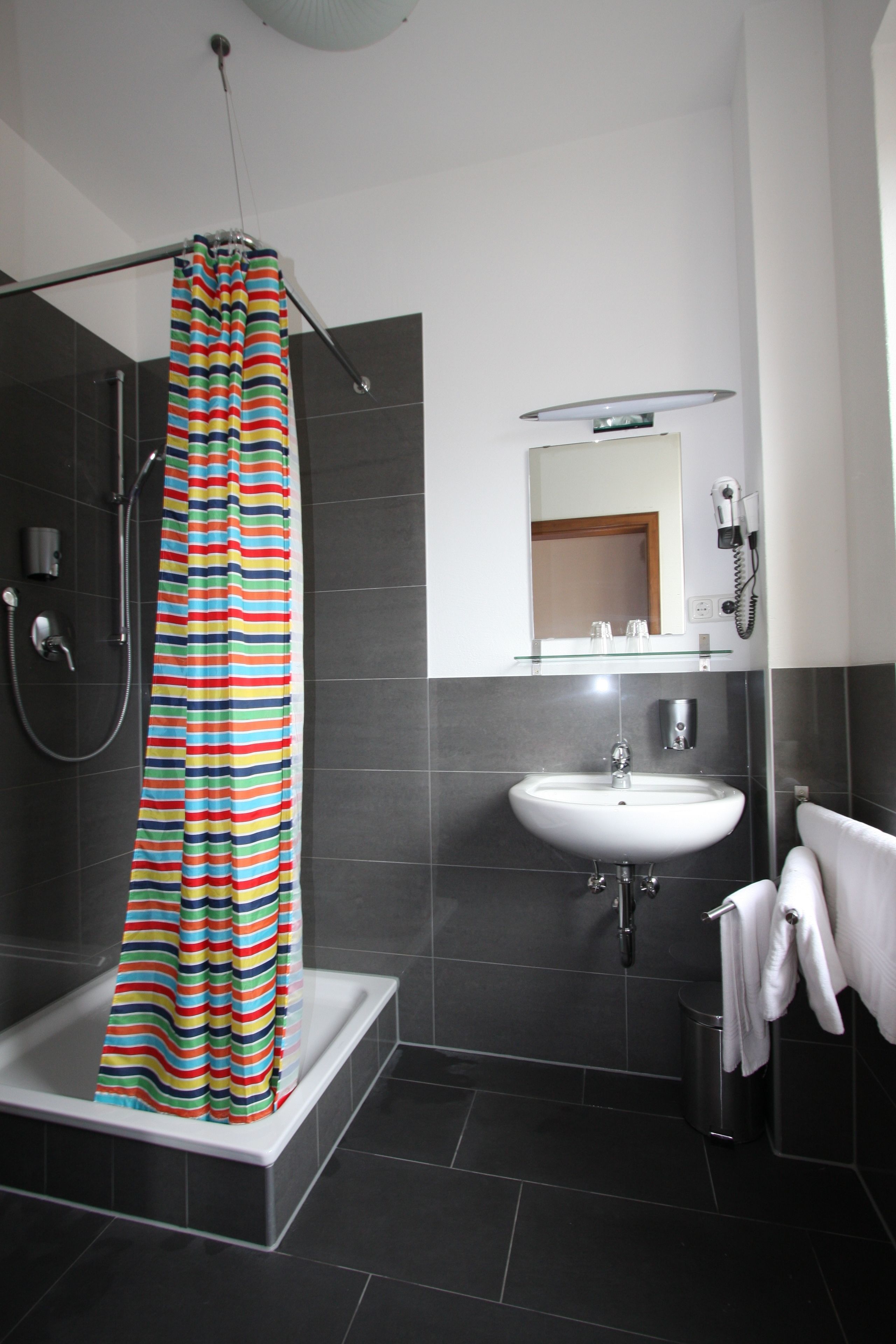 shower, free toiletries, hair dryer, towels