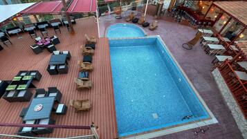 Seasonal outdoor pool, pool umbrellas, pool loungers