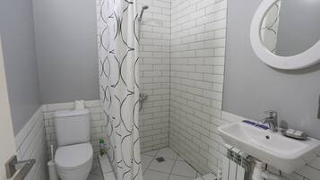 Economy Double Room | Bathroom | Shower, free toiletries, hair dryer, slippers