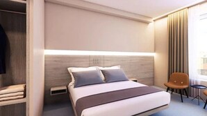 Een moderne hotelkamer met een groot bed, nachtkastje, stoel en een kledingkast.