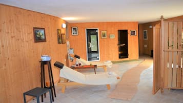 Relax in comfort with two reclining chairs and a small table for a quiet moment.