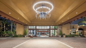 A hotel entrance with a large circular chandelier, a brick facade, and a sign reading "TWENTY20". - Westin Carlsbad Resort & Spa (Carlsbad)