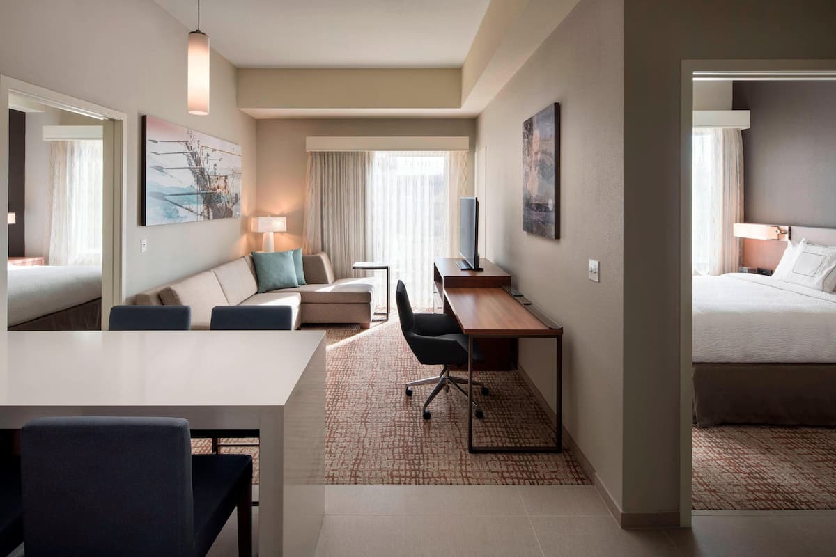 Suite, 2 Bedrooms | Living area | 50-inch LCD TV with cable channels, TV