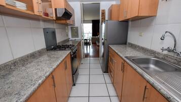 Deluxe Apartment, 2 Bedrooms, Ocean View, Oceanfront | Private kitchen | Fridge, microwave, oven, stovetop