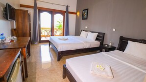 A hotel room with two beds, a wooden desk, a television, and a balcony with curtains. - Riviera Hotel & Resort Kep (Kep)
