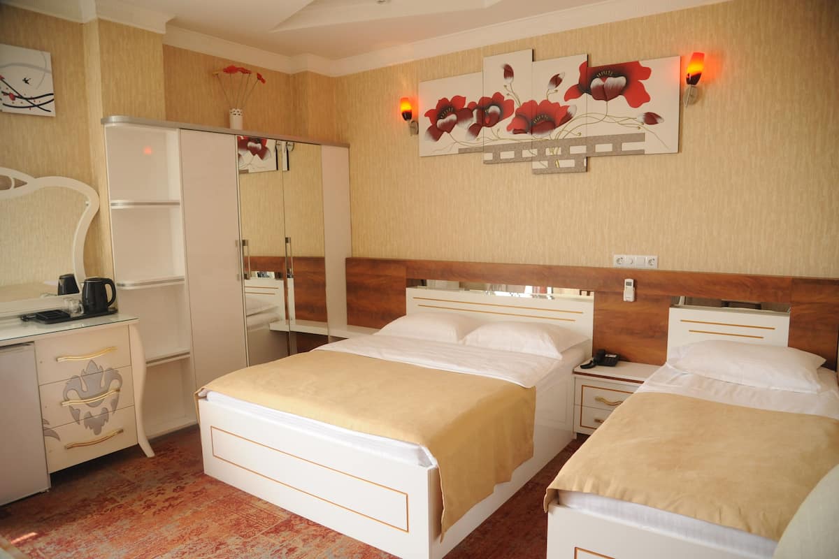 Economy Triple Room, 1 Bedroom | 1 bedroom, premium bedding, minibar, in-room safe