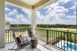 The second floor Master bedroom features a beautiful balcony perfect for the evening glass of wine