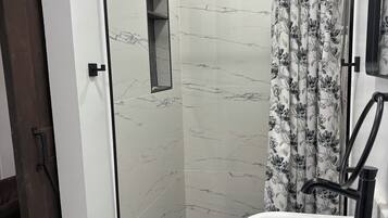 Bathtub, hair dryer, towels, soap