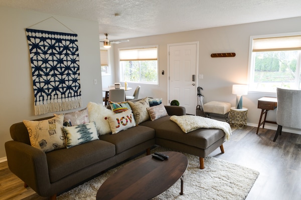spacious living room with tasteful decor and upscale furniture