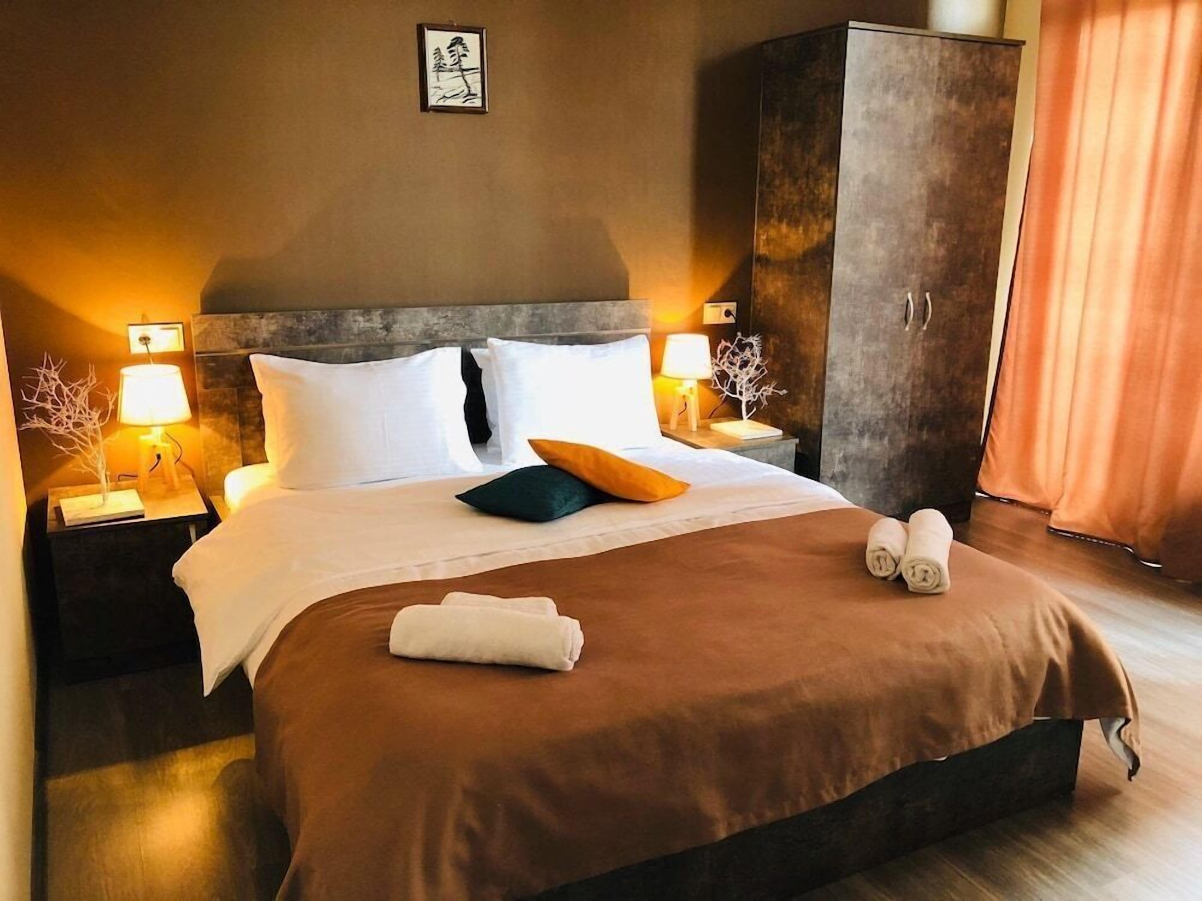 Premium bedding, desk, laptop workspace, soundproofing