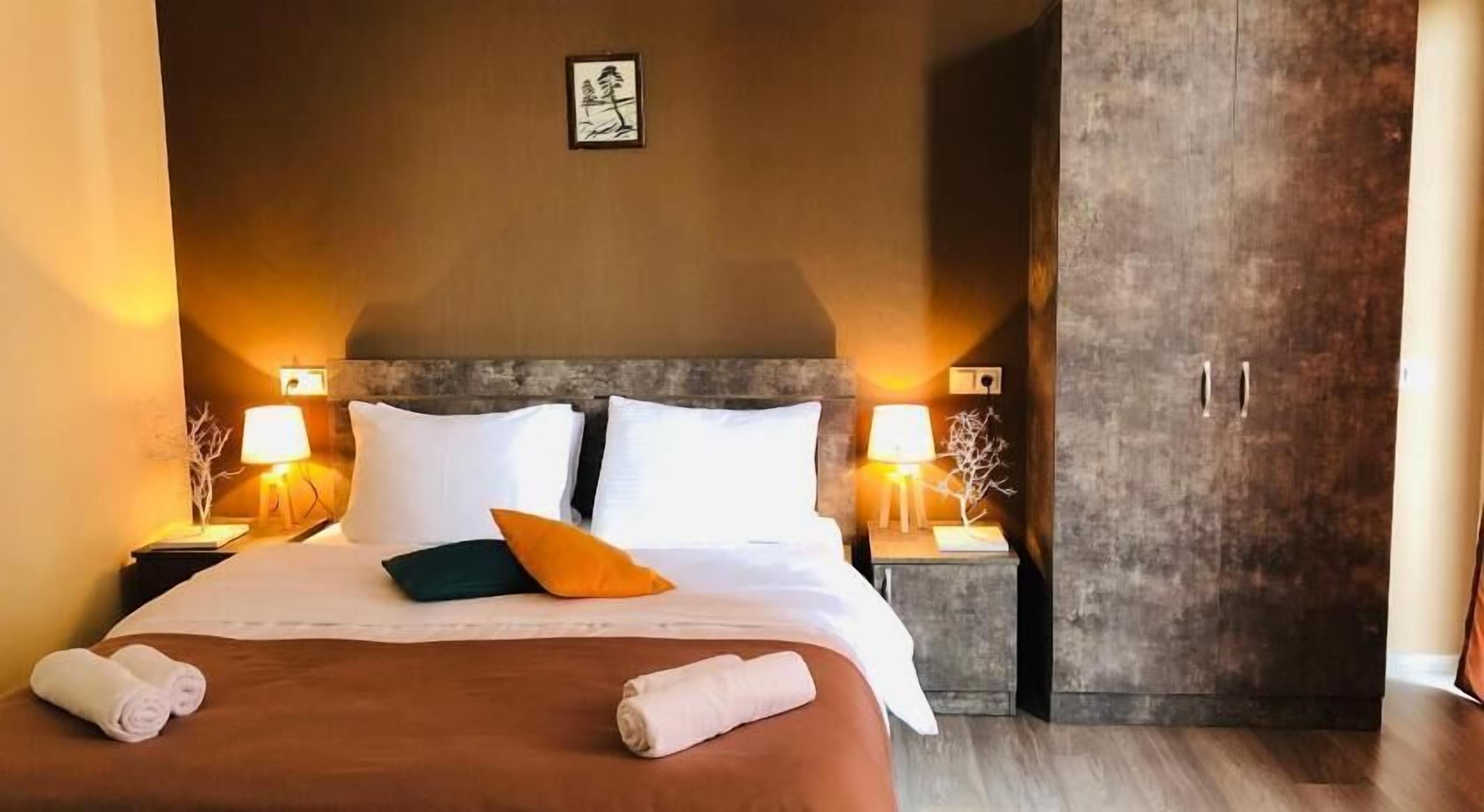 Premium bedding, desk, laptop workspace, soundproofing