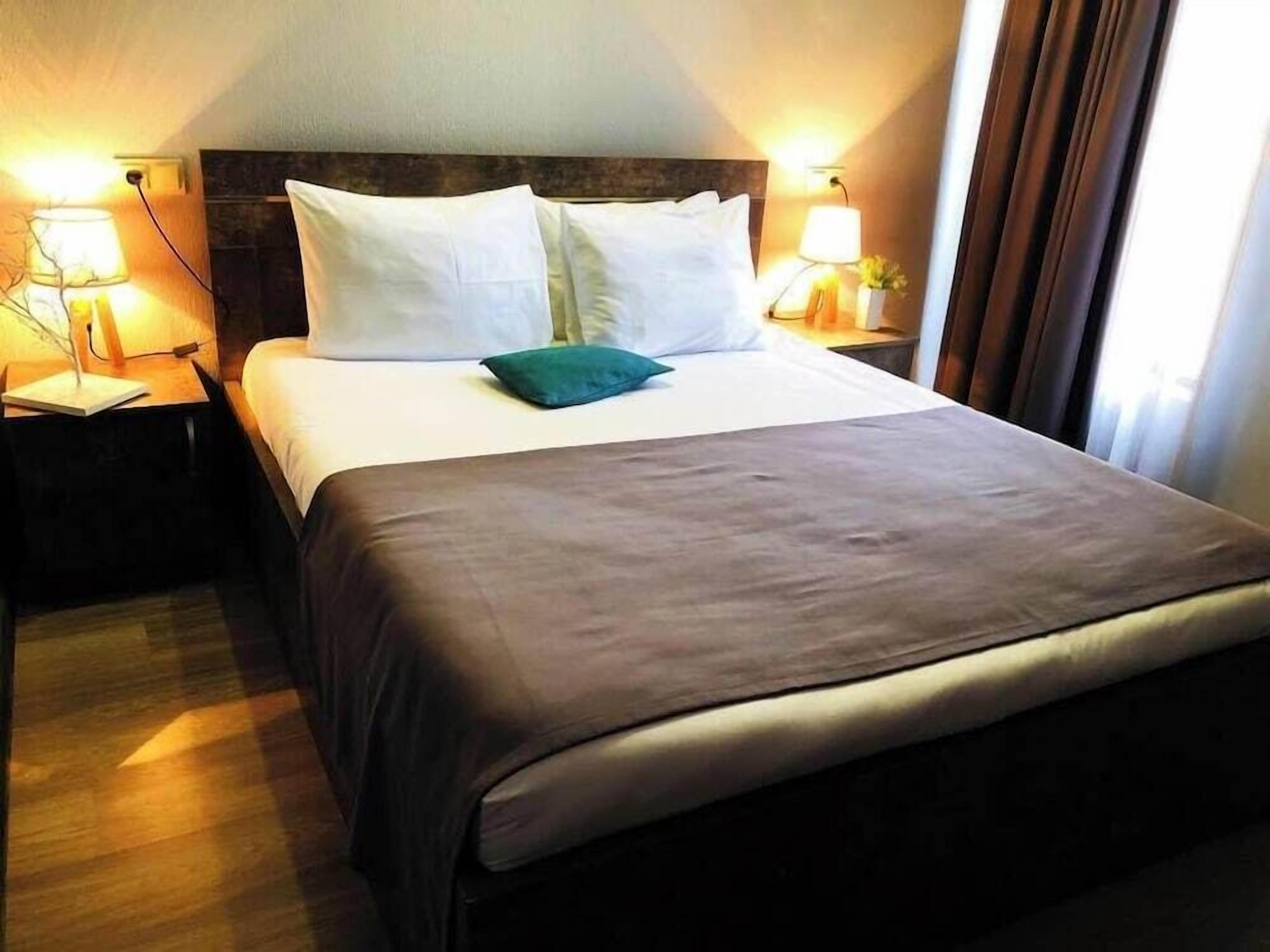 Premium bedding, desk, laptop workspace, soundproofing