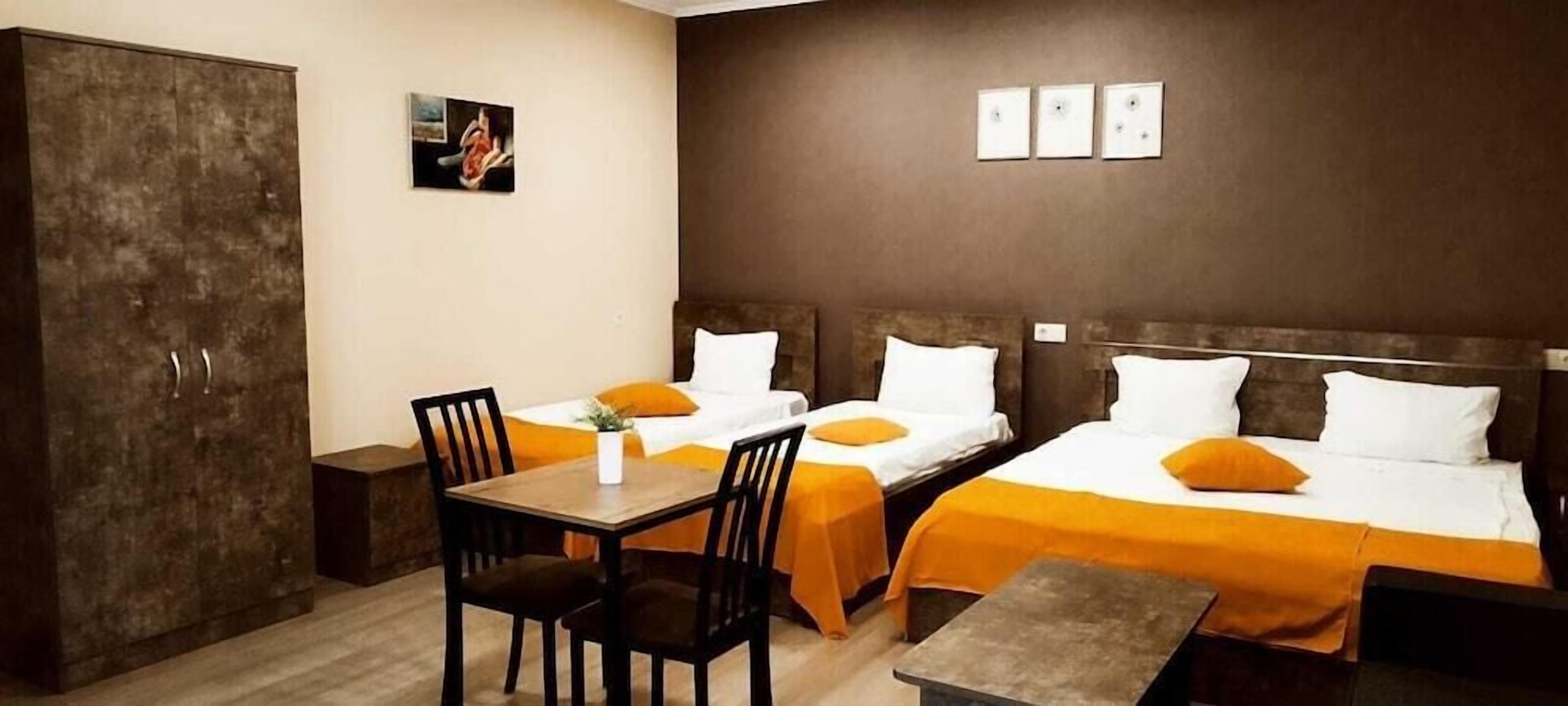 Premium bedding, desk, laptop workspace, soundproofing