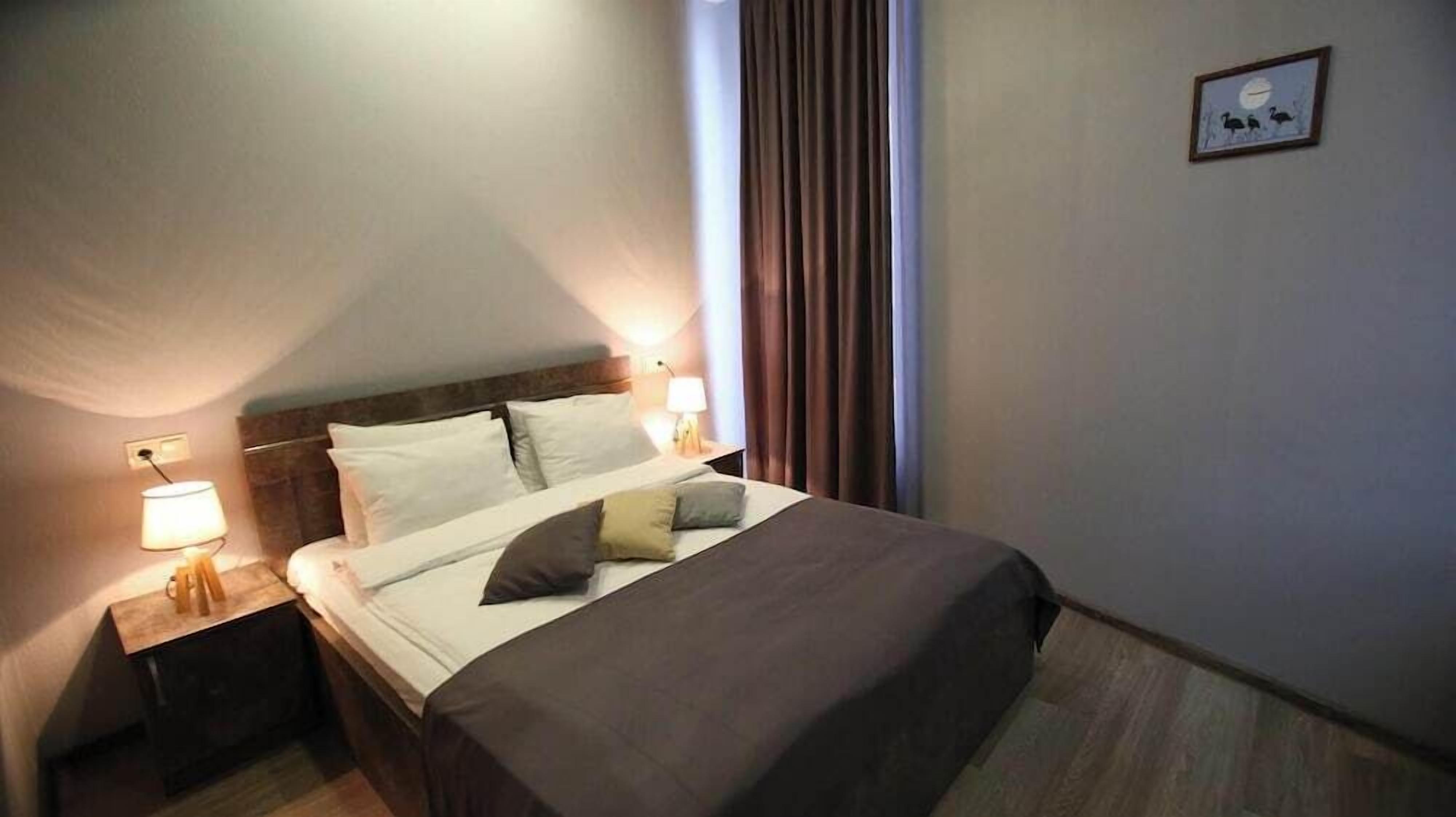 Premium bedding, desk, laptop workspace, soundproofing