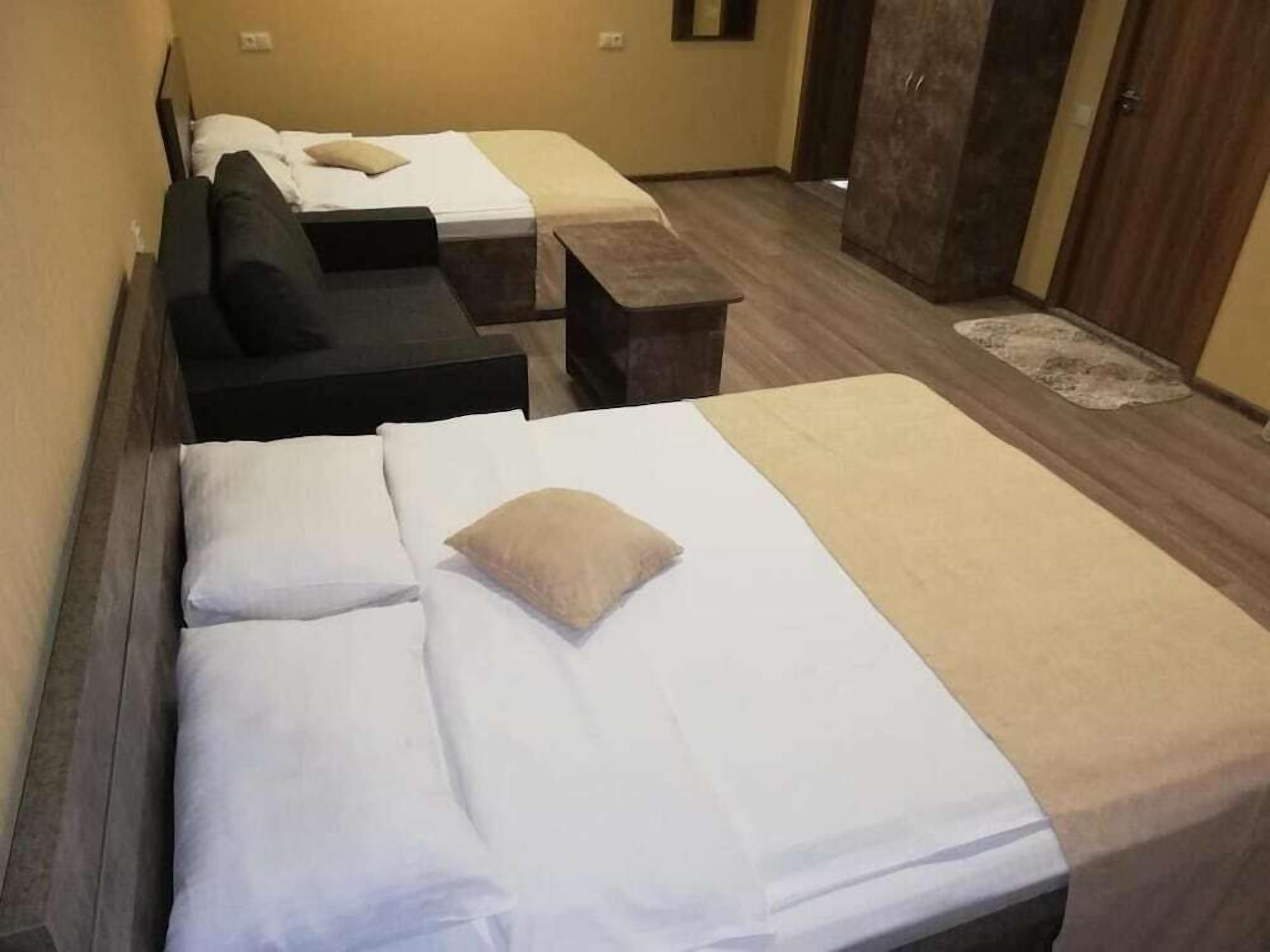 Premium bedding, desk, laptop workspace, soundproofing