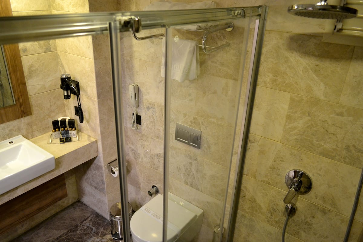 Shower, free toiletries, hair dryer, slippers