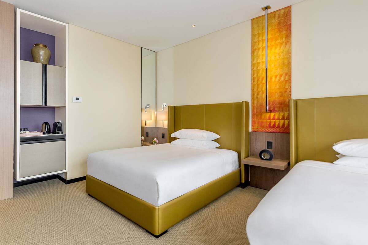 Premium bedding, down duvets, free minibar items, in-room safe