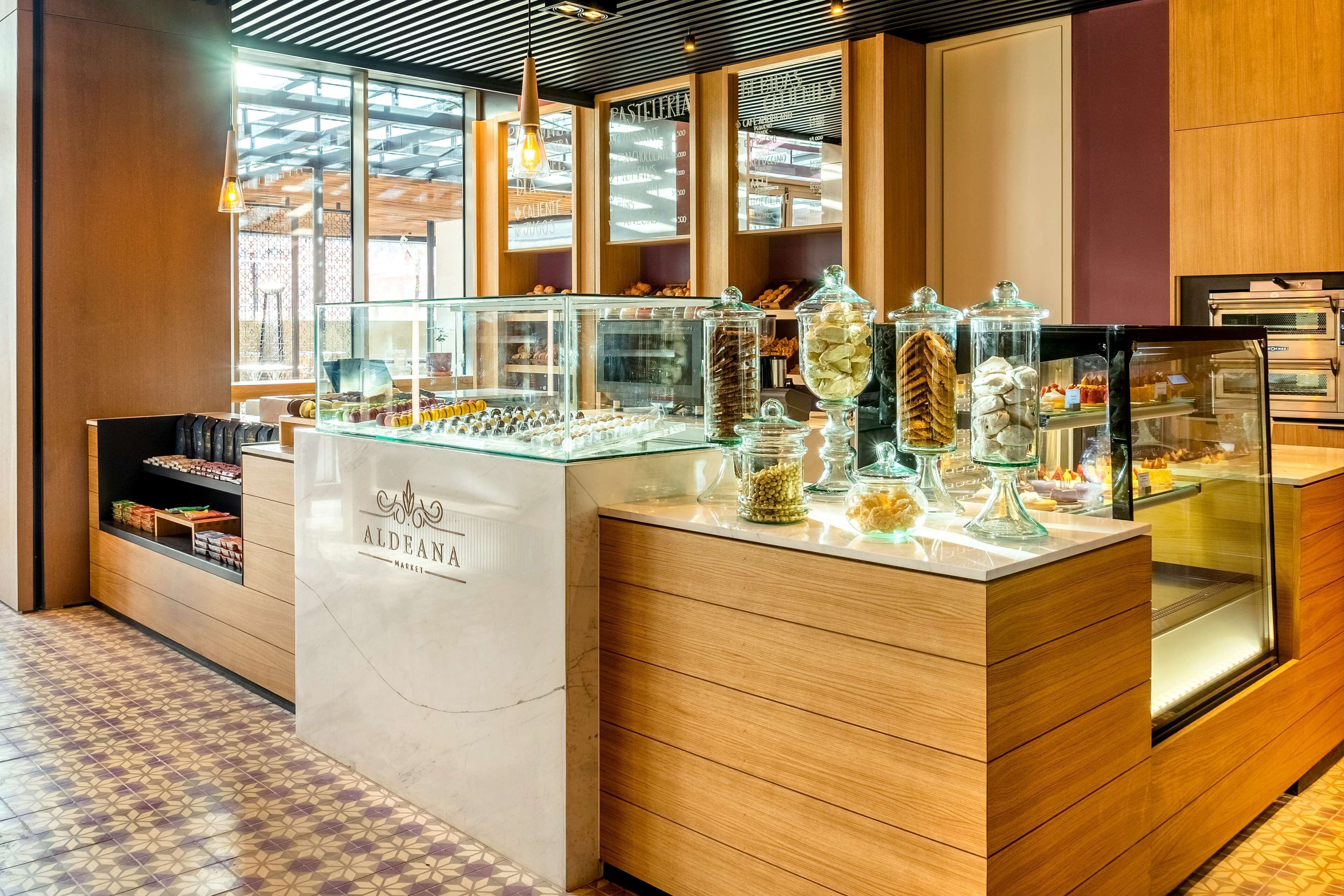 A bakery counter with glass display cases and a marble countertop.