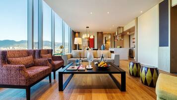 Premium bedding, down comforters, free minibar items, in-room safe