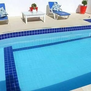 Outdoor pool, pool umbrellas, pool loungers