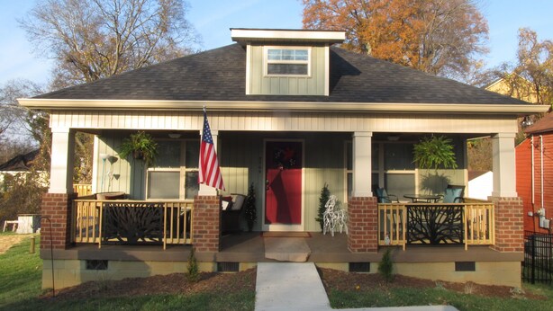 A two-story house with a front porch, a red door, and an American flag. - Kathy's Kottage. Bungalow on the side of Missionary Ridge, Furry Friends Welcome (Chattanooga)