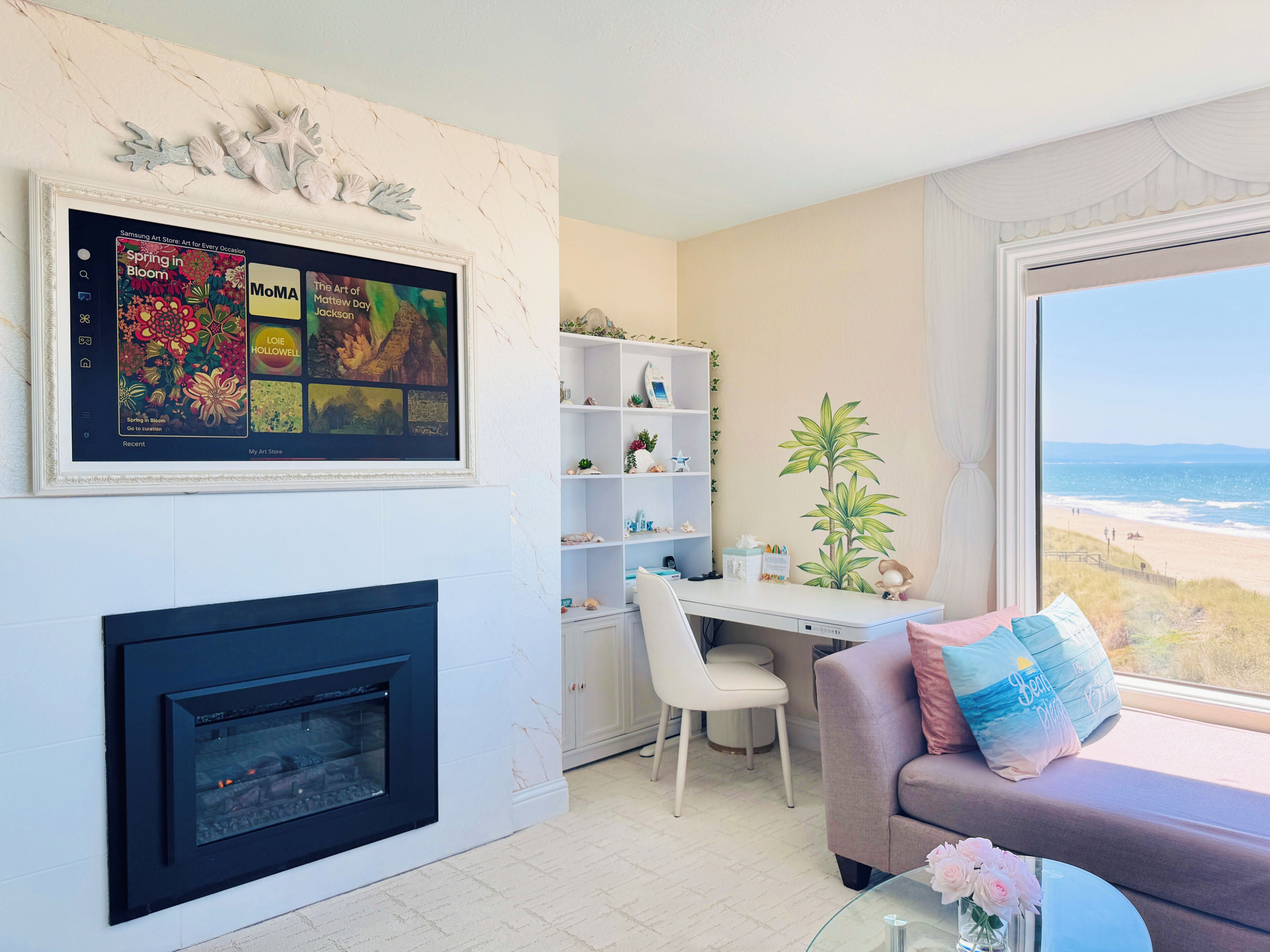 Smart TV, fireplace, books, computer monitors