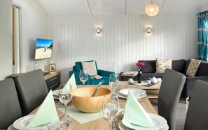 Relax in style with comfortable seating and a dining area, perfect for socializing or unwinding.