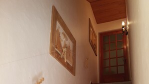 A staircase with wooden steps and a wooden handrail, leading to a door with glass panels. - Val D'Allos mountain chalet for 8 people (Villars-Colmars)