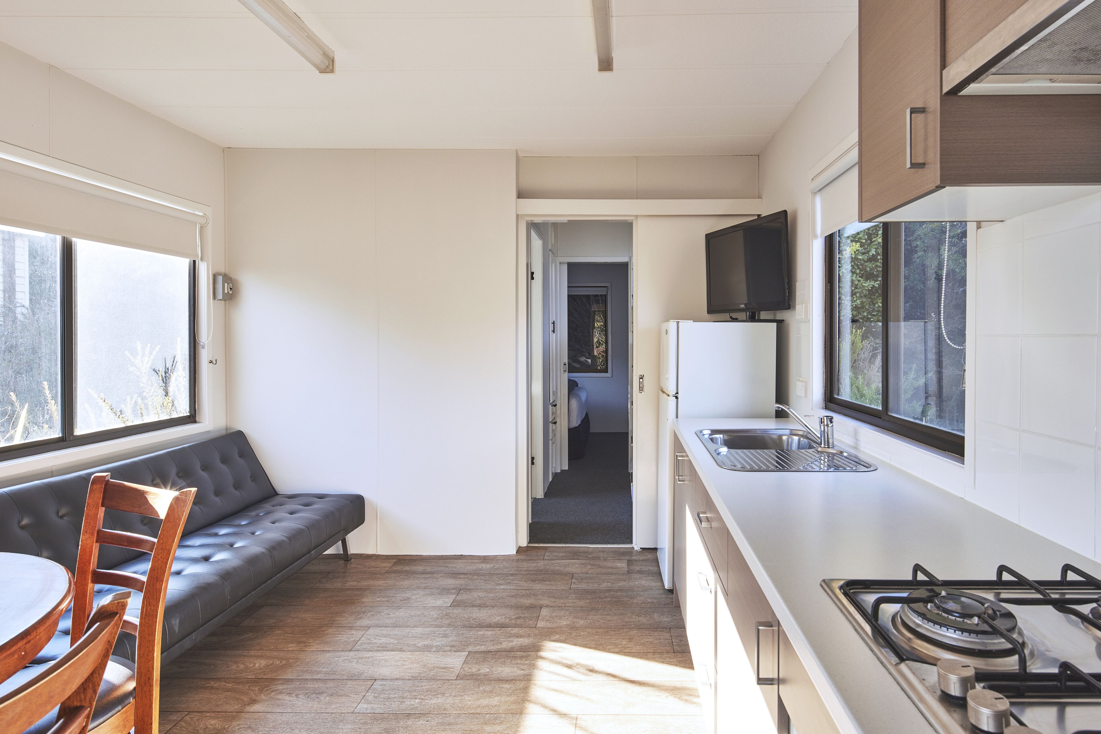 One Bedroom Prospector Cabin | Living area | Flat-screen TV