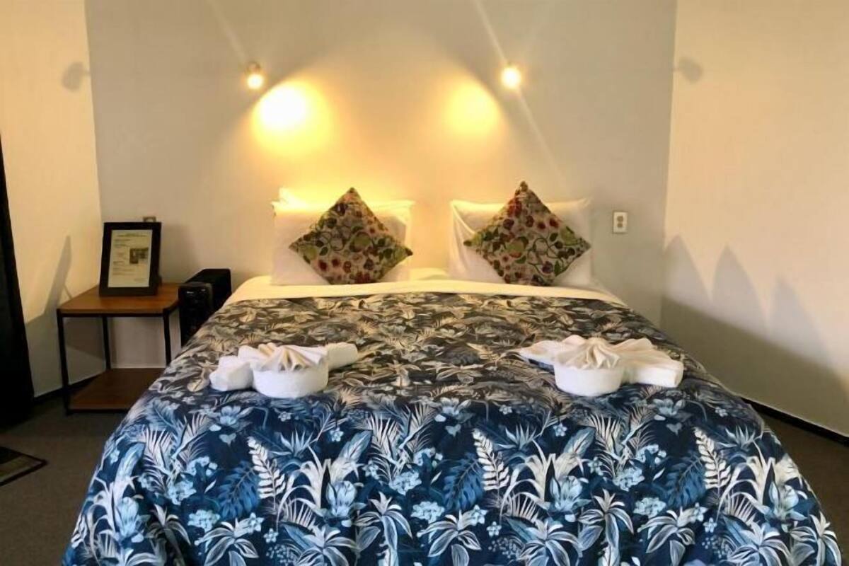 Premium bedding, pillow-top beds, free minibar, laptop workspace