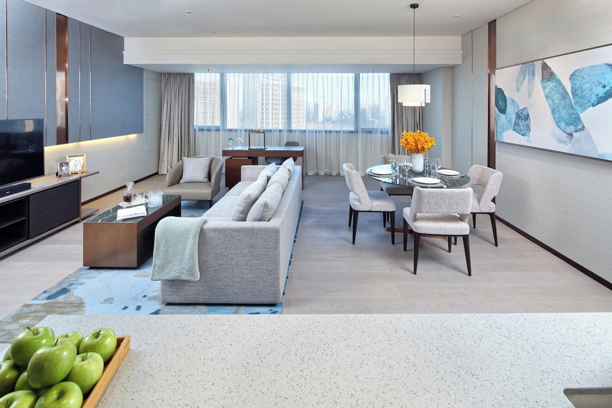 Executive Room, 2 Bedrooms | Living area | 55-inch LED TV with cable channels, TV, iPod dock