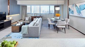 Executive Suite, 2 Bedrooms | Living area | 55-inch LED TV with cable channels, TV, iPod dock