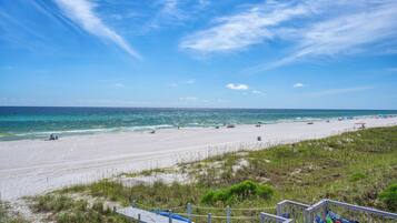 On the beach, sun loungers, beach towels