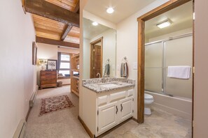 Combined shower/bathtub, hair dryer, towels, soap