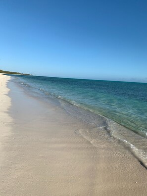 On the beach, sun loungers, beach towels