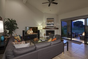 Smart TV, fireplace, books, stereo