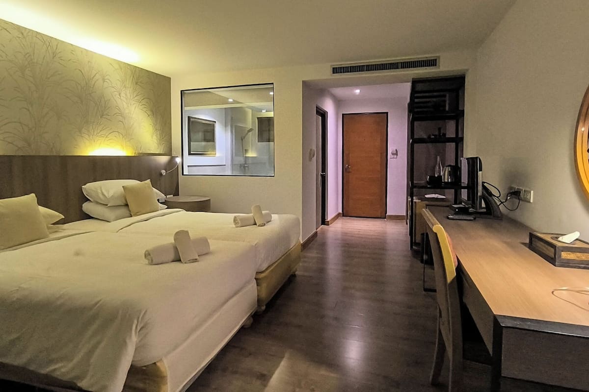 Deluxe Room with Garden View | Luxe beddengoed, een minibar, gratis wifi, beddengoed