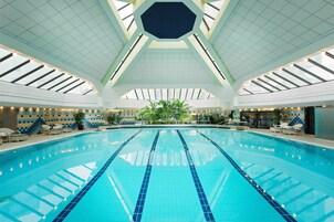 Indoor pool, open 7:00 AM to 10:00 PM, pool loungers, lifeguards on site