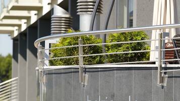 A modern building with a sign reading 'Baltic Plaza Hotel Medi SPA' and a staircase leading to the entrance.