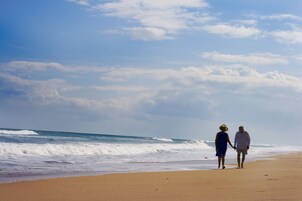 On the beach, sun-loungers, beach towels