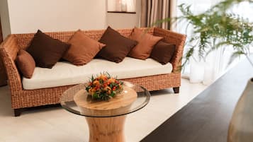 Luxury Suite | Living area | 32-inch flat-screen TV with satellite channels, TV