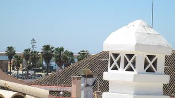 A building with a white dome and a tiled roof.