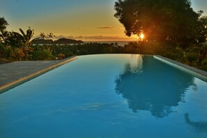 Outdoor pool, pool umbrellas, sun loungers