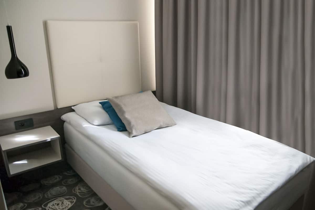 Economy-Einzelzimmer | Schallisolierte Zimmer, Babybetten, kostenloses WLAN, Bettwäsche