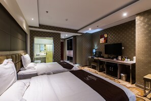 Habitación Deluxe con 2 camas individuales | Minibar, escritorio, cortinas blackout y insonorización 