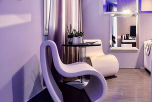 Luxury Suite, 1 Bedroom, Balcony | Living area | Flat-screen TV, first-run movies