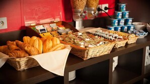 A breakfast buffet with croissants, bread, and various spreads. - Hôtel Eurocentre Toulouse Nord 2 Stars (Castelnau-d'Estretefonds)