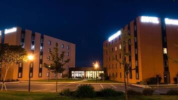 Hotel offers comfortable accommodations with a flat roof and symmetrical design.
